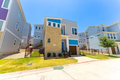View of front of property with a gate, a resident