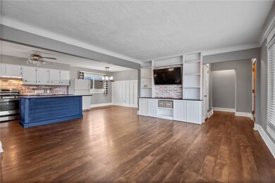 An open floor plan, living room looking into the k