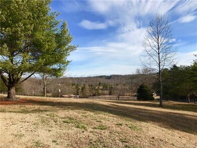 View from driveway looking down toward pasture and