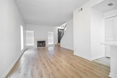 A cozy living room featuring a Wood-burning firepl
