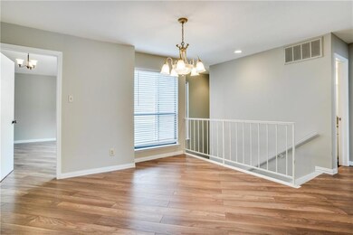 Stairway leading up to this unit. Dining area unde