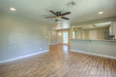 Open living, kitchen & dining.