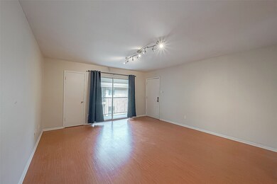 Living room has a sliding glass door leading to th