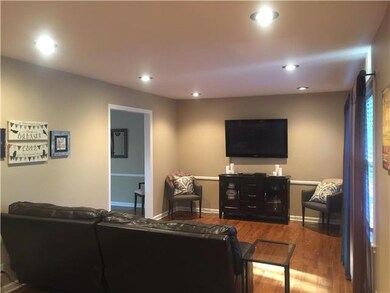 Walk in to your living room with hardwood floors, 