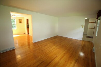 The living room has openings to the foyer and dini
