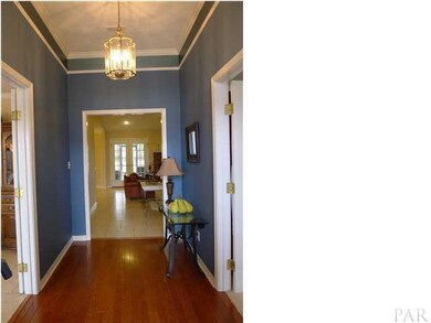Foyer welcomes you with hardwood floors and high ceilings.
