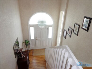 Foyer showing front entrance. Chandelier does stay