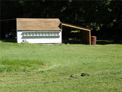 Large shed with open lean to