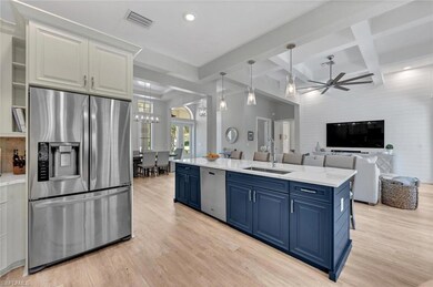 Kitchen with blue cabinets, visible vents, a sink, and stainless steel appliances