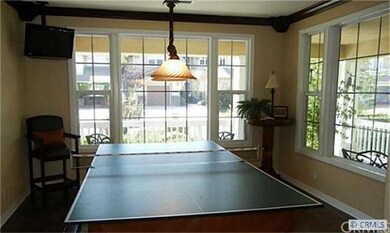 Formal living room currently used as a game room.
