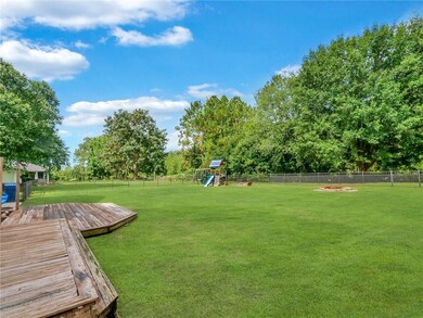 Backyard features lots of patio/Decking, fenced w/