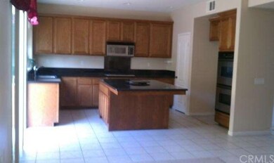 KITCHEN WITH CUSTOM ISLAND, DOUBLE OVEN, MICROWAVE