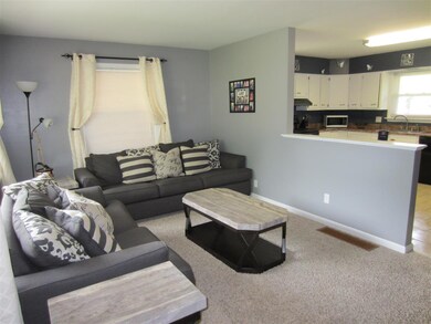 The Living Room is partially open to the Eat-In Ki