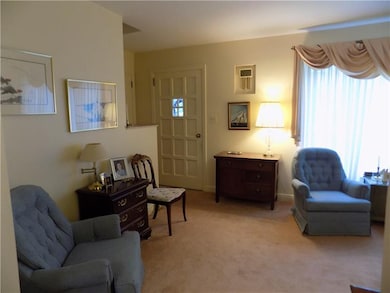 Front entrance to living room and stairs.