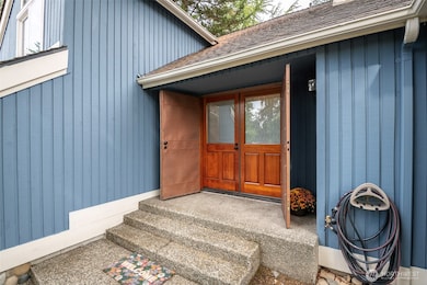 Beautiful solid wood double doors greet you!