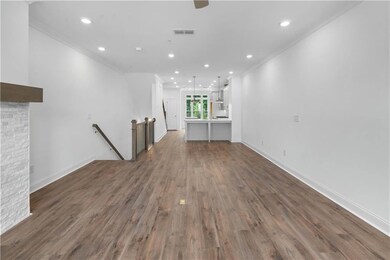 As you reach the main floor, you find an open family room, dining area and kitchen with a seamless flow for everyday living.