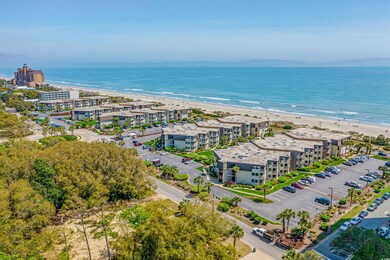 Drone / aerial view with a water view and a beach view
