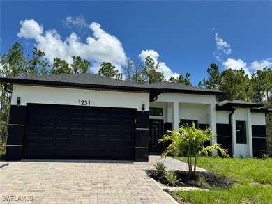View of front of property featuring stucco siding,