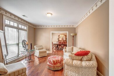 Large Formal Living Room with Hardwood Floors and 