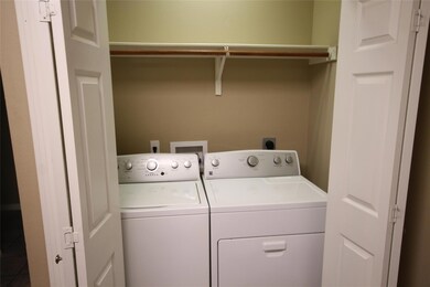 Laundry area with washer and clothes dryer