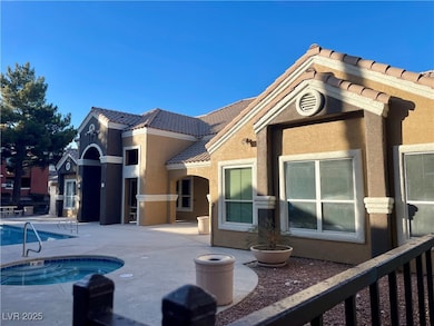 BACK OF CLUBHOUSE AND MAIN POOL