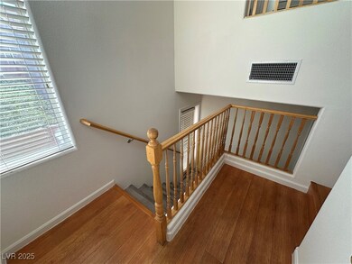 Stairway featuring wood finished floors, baseboard