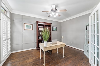 Beautiful paneling and wood floors grace the home