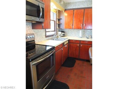 Kitchen with tile backsplash.