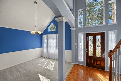 Open the door to a light and bright home full of warmth!  Leaded glass doors with sidelight windows, and a plethora of windows perched above create such a vibe!