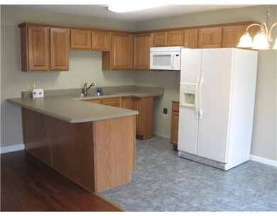 Kitchen. A new range is being installed soon. Note the eat-at breakfast counter.