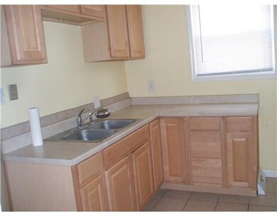 Kitchen. Newer oak cabinets & ceramic floor