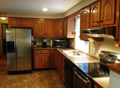 The large kitchen features stainless...