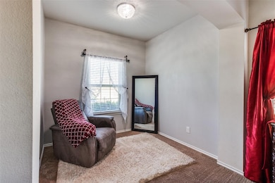 Living area featuring carpet flooring