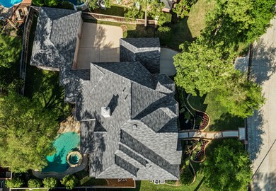Spacious driveway with three car garage.