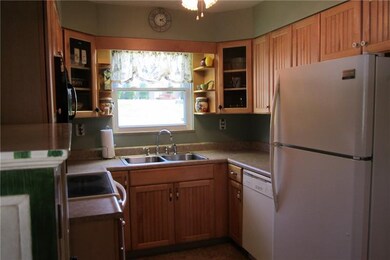 The kitchen was updated in 2002 with maple cabinet