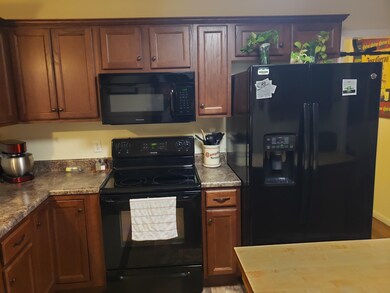 Frigidaire stove and microwave. Refrigerator is Whirlpool (conveys with sale)