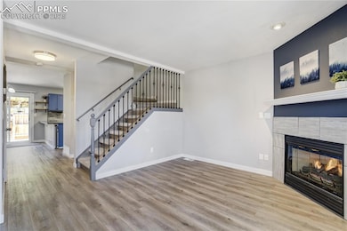 Unfurnished living room with wood finished floors,