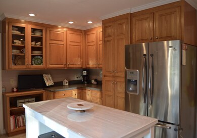 Kitchen has plenty of cabinet space and room for a breakfast table