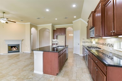 Kitchen with a ceiling fan, tasteful backsplash, 