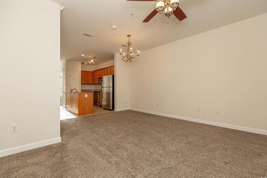 Unfurnished living room featuring visible vents, l