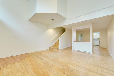Empty room with visible vents, baseboards, a high