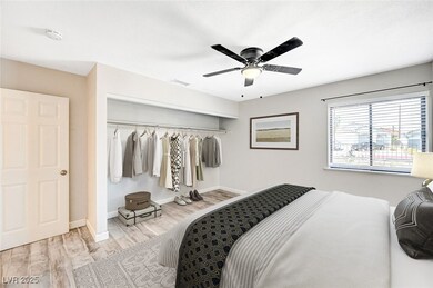 Bedroom featuring a closet, wood finished floors, and ceiling fan