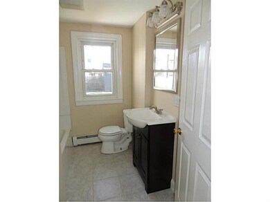 Bathroom. Modern fixtures with ceramic tile floor.