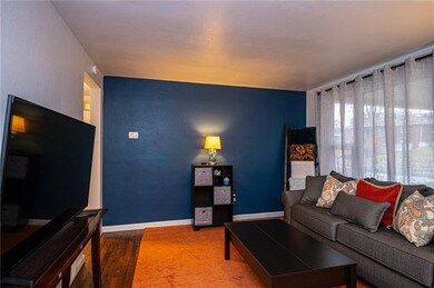 Large bright living room with beautiful hardwood f