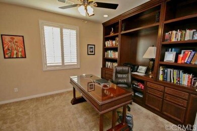 Office has gorgeous custom built-in cabinetry, pla