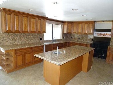 Upgraded kitchen with granite counters, island, an