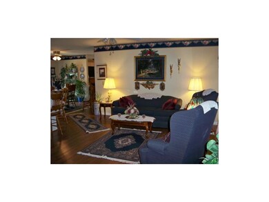 Formal living room w/ laminate flooring.