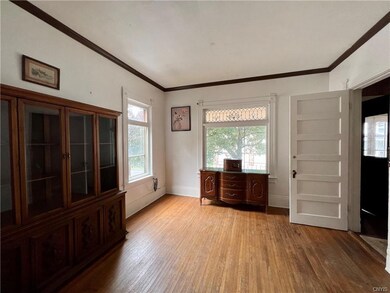 You enter into a large living room . . .