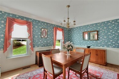 Large dining room with chair rail and crown mouldi