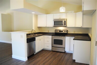 Bright white kitchen cabinets with updated applian